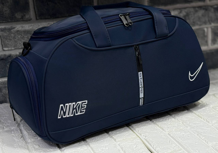 ساک ورزشی طرح چرم زیپ وسط جا کفشی دار با آستر خارجی نایک با کد محصول ۲۰۹