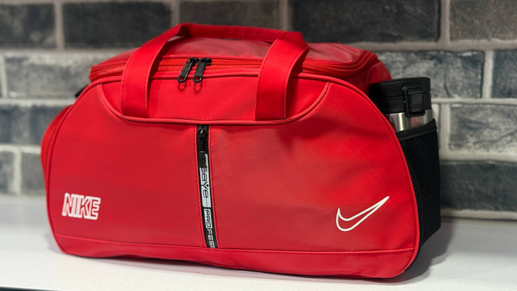 ساک ورزشی طرح چرم زیپ وسط جا کفشی دار با آستر خارجی نایک با کد محصول ۲۰۹